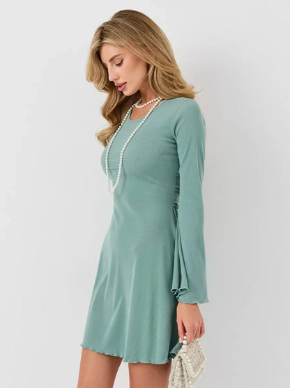 Mint Sculpt Mini dress in soft green, featuring long sleeves and an A-line cut for a chic summer look.
