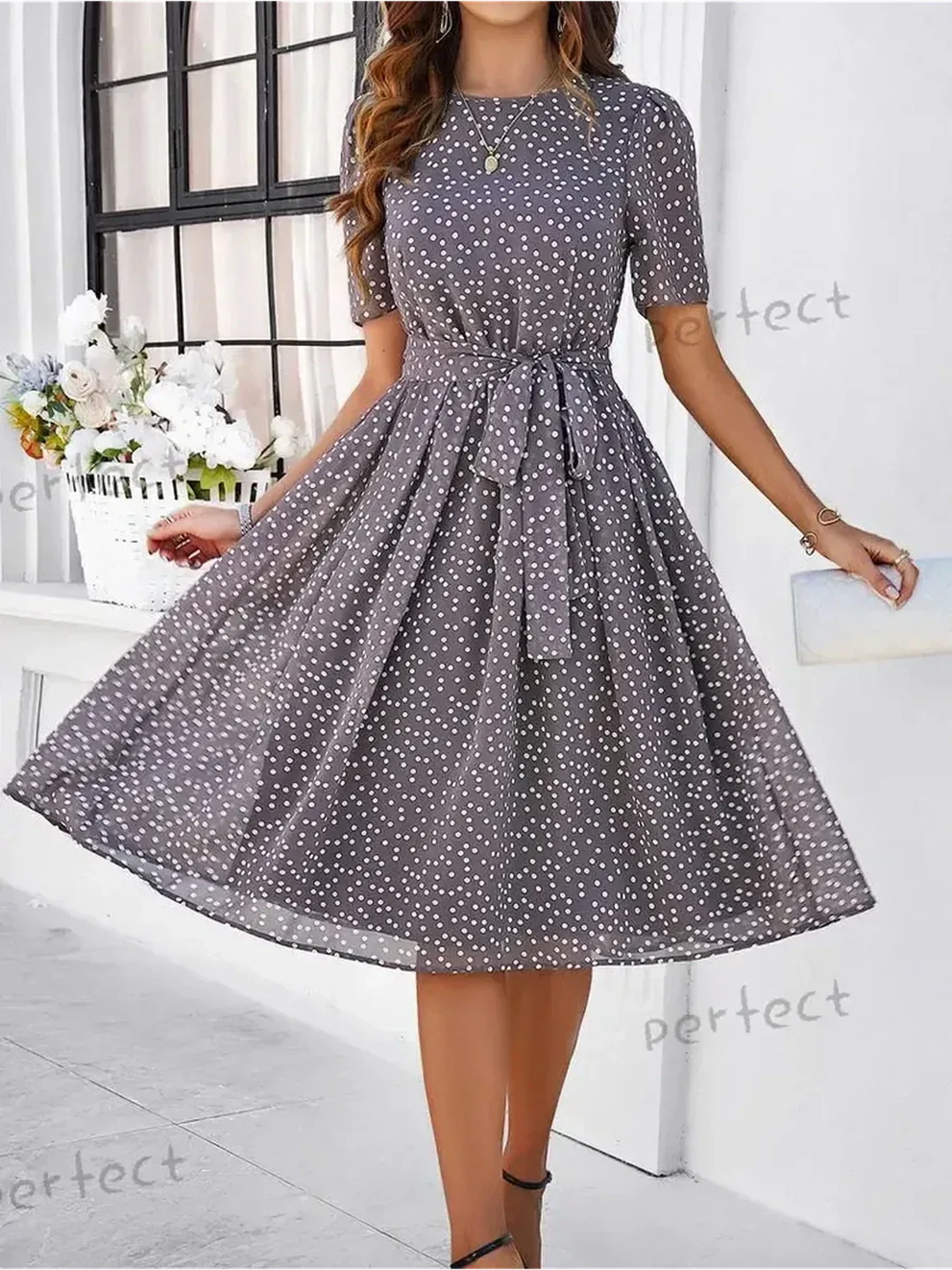 Serene Charm Midi Dress in polka dots, perfect for summer events, weddings, and semi-formal occasions.