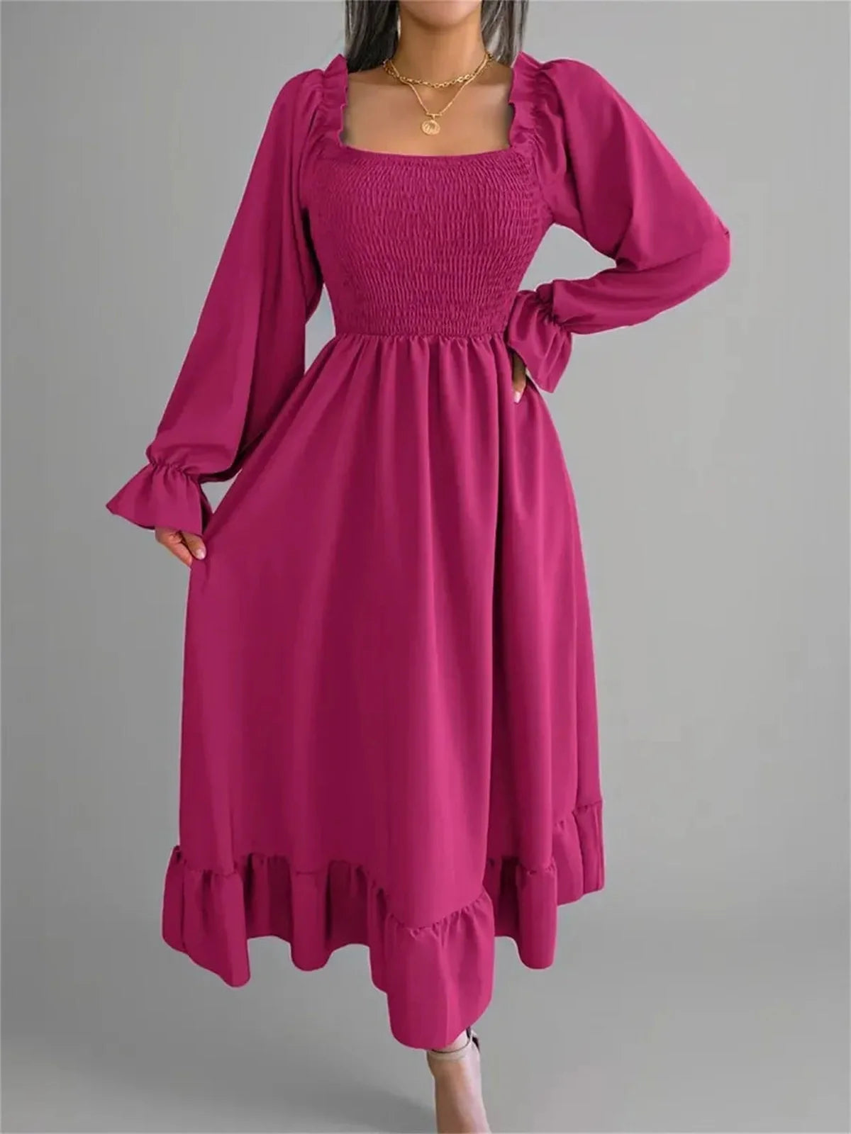 Roselle Midi Dress in bold magenta, featuring smocked bodice, ruffled neckline, and elegant long sleeves, perfect for any occasion.