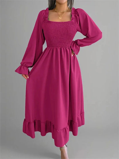 Roselle Midi Dress in bold magenta, featuring smocked bodice, ruffled neckline, and elegant long sleeves, perfect for any occasion.