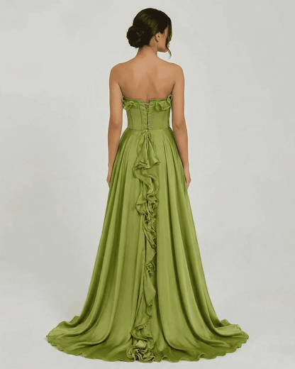 Back view of the strapless Verdessa Maxi Dress by Slimona, featuring a flowing green silhouette and ruffle details.
