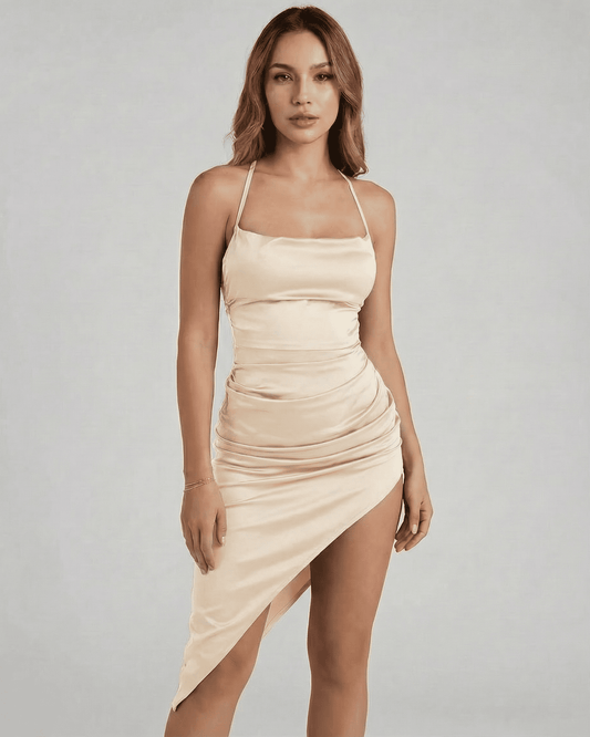 Calista Midi Dress by Slimona featuring a satin bodycon silhouette and strappy open back in champagne color.