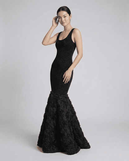 Slimona Nocturne Maxi Dress featuring a sculpted black silhouette with textured hem detail.
