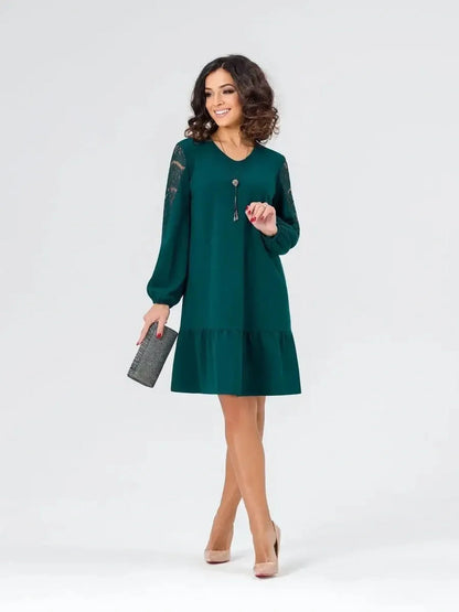 Model wearing a green Lace Charm mini dress with lace detailing and a relaxed fit, perfect for weddings and casual occasions.
