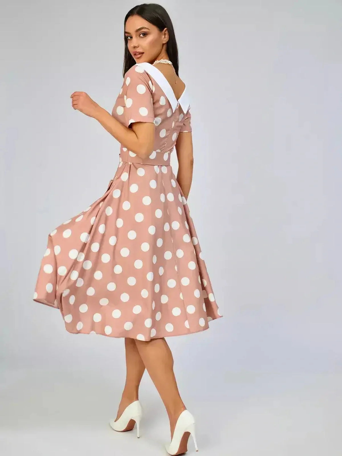 Vintage Muse Midi Dress in soft beige with polka dots and white collar, perfect for summer weddings or elegant gatherings.