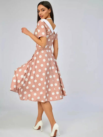 Vintage Muse Midi Dress in soft beige with polka dots and white collar, perfect for summer weddings or elegant gatherings.