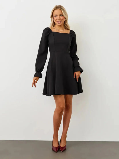 Elegant black Velvet Hour Mini Dress featuring a square neckline and voluminous sleeves, perfect for various occasions.
