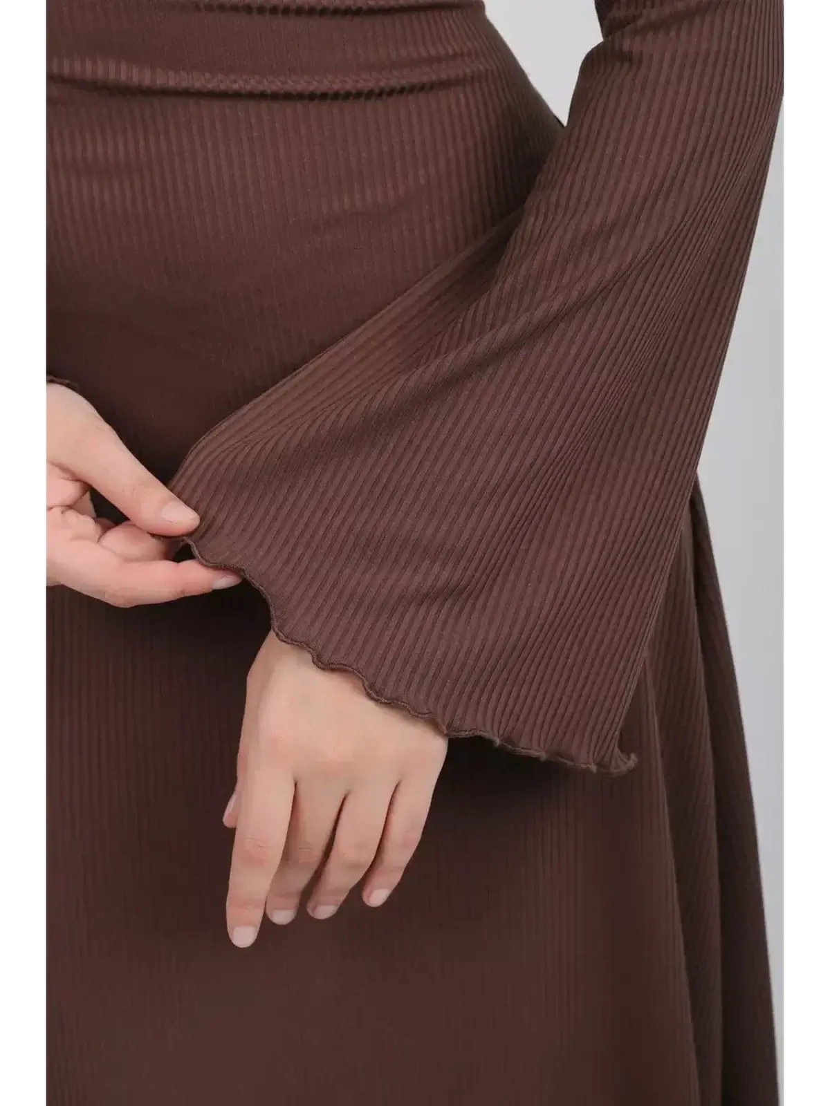 Close-up of flared sleeve detail on Sculpted Grace Midi Dress in coffee-toned ribbed knit.