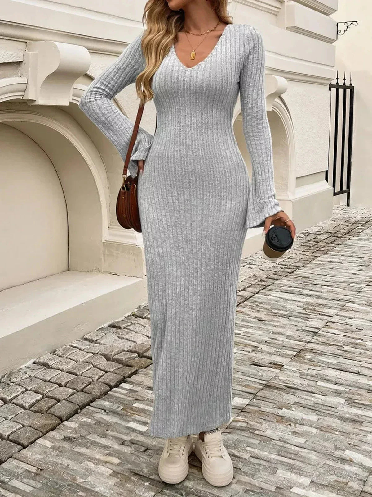 Stylish woman in a grey Sculpted Soft Midi Dress with flared sleeves, perfect for summer and special occasions.