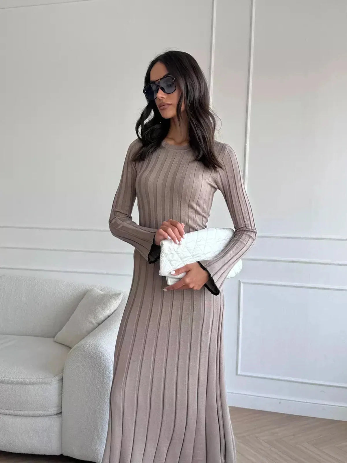 Model in a ribbed knit Contour Maxi Dress, showcasing its elegant silhouette and versatility for any occasion.
