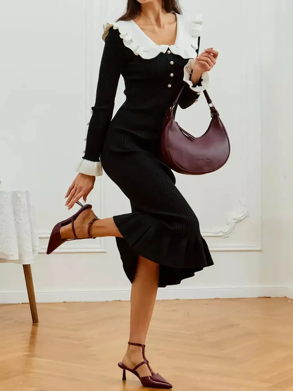 Monaco Midi Dress in black with pearl trim and flared cuffs, perfect for weddings, formal occasions, and cocktail parties.