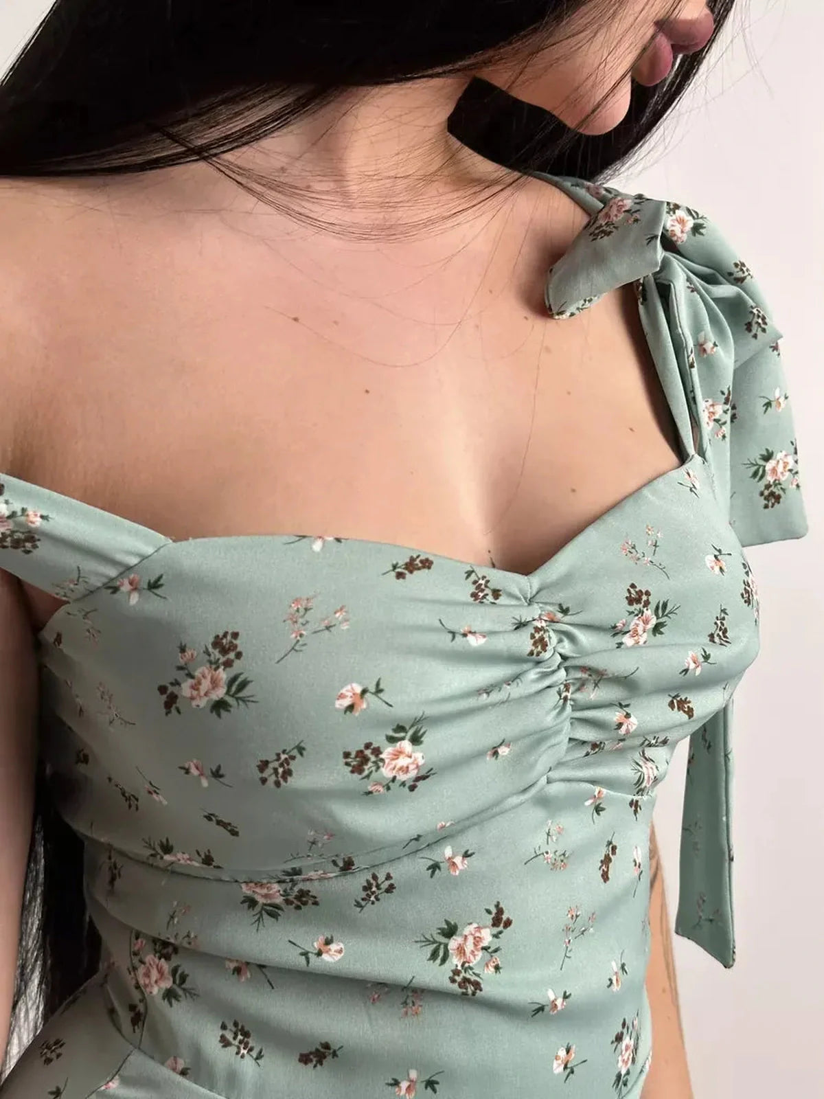 Close-up of the Flora Grace Midi Dress featuring a ruched sweetheart bodice and delicate shoulder ties.