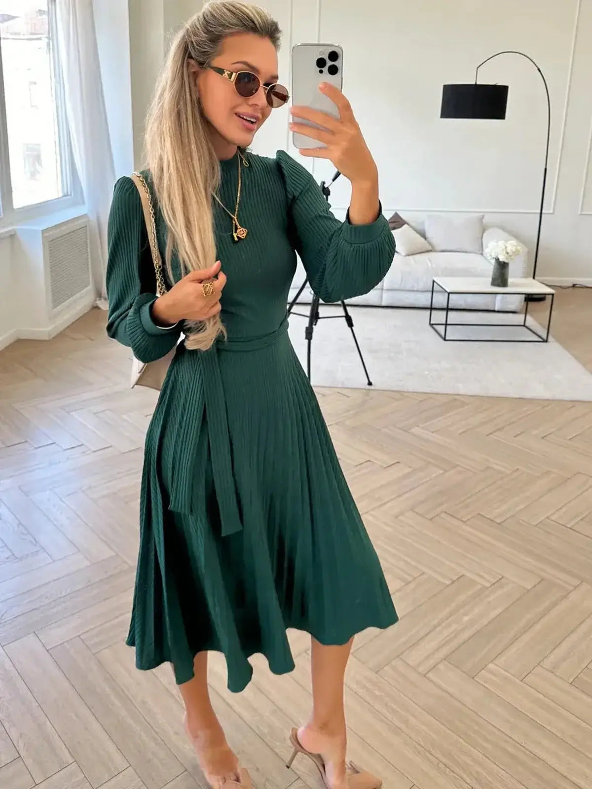 Emerald Poise Midi Dress featuring pleated elegance and ribbed texture, perfect for weddings and special occasions.