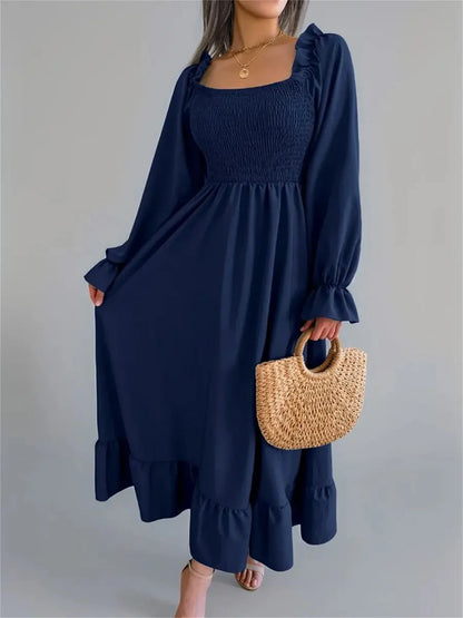 Navy blue midi dress with smocked bodice and flounce hem, perfect for weddings, brunch, and casual outings.
