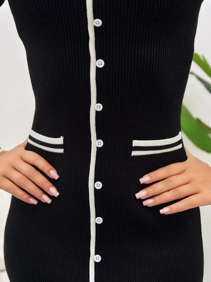 Close-up of the Contrast Button Midi Dress featuring a ribbed black fabric, stylish contrast trim, and button details.