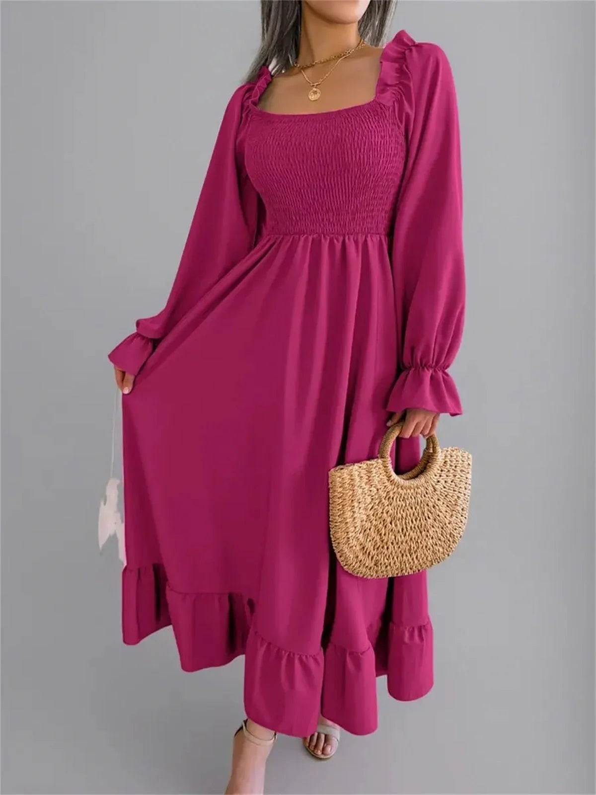 Roselle Midi Dress in bold magenta with smocked bodice and ruffled hem, perfect for spring and occasions.