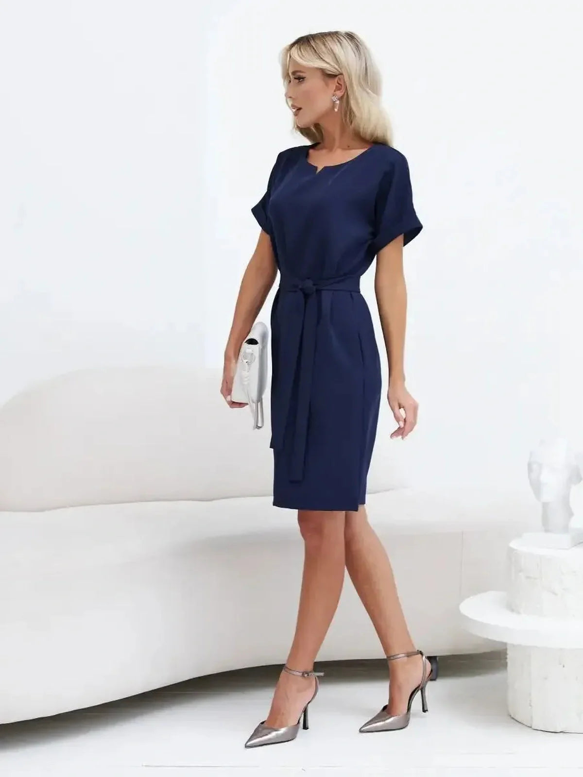 Elegant Navy Line mini dress featuring a structured silhouette and belt, perfect for weddings and events.