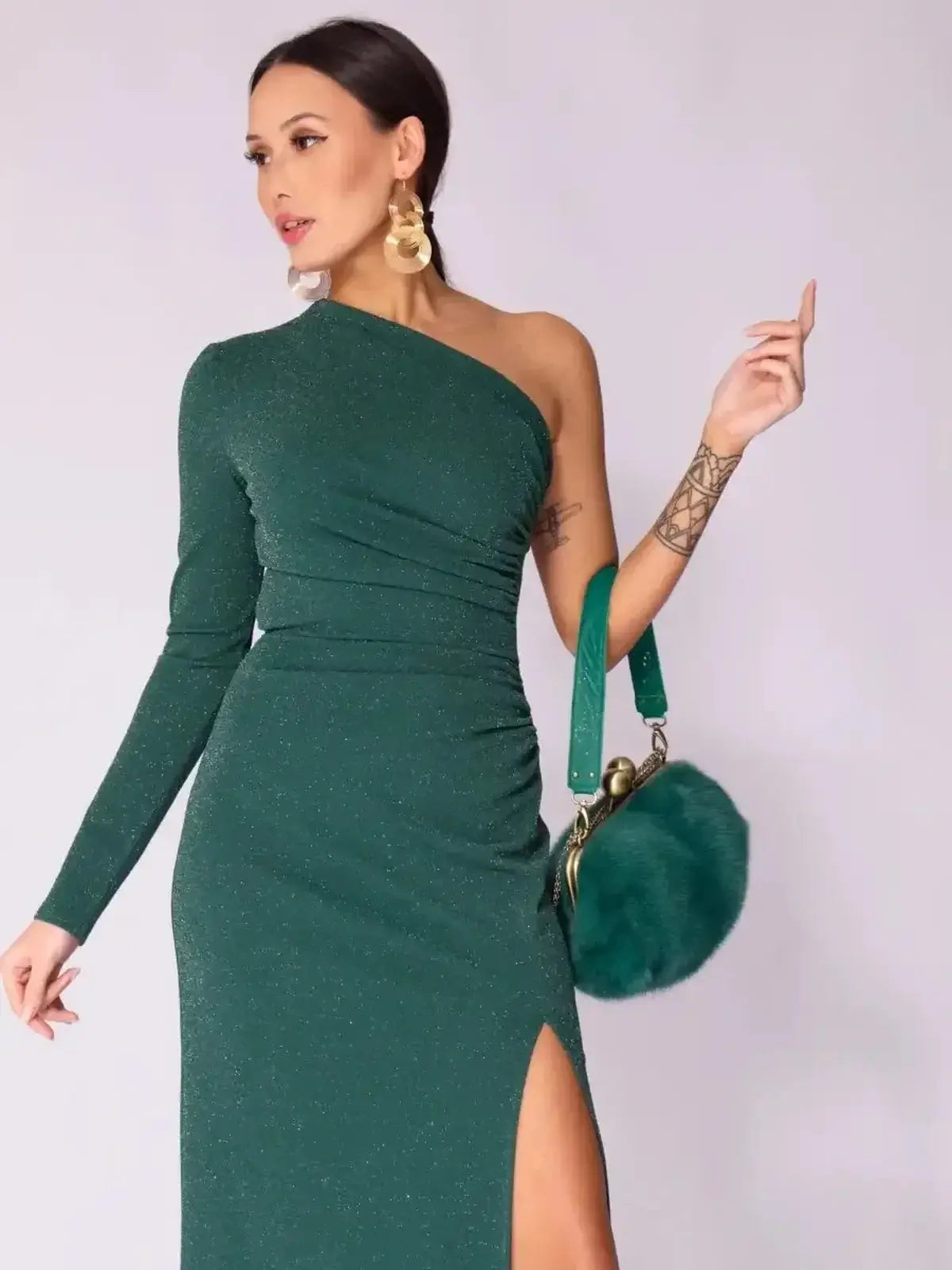 Emerald Spark Maxi Dress showcasing one-shoulder elegance, high side slit, and shimmer, perfect for formal and wedding events.