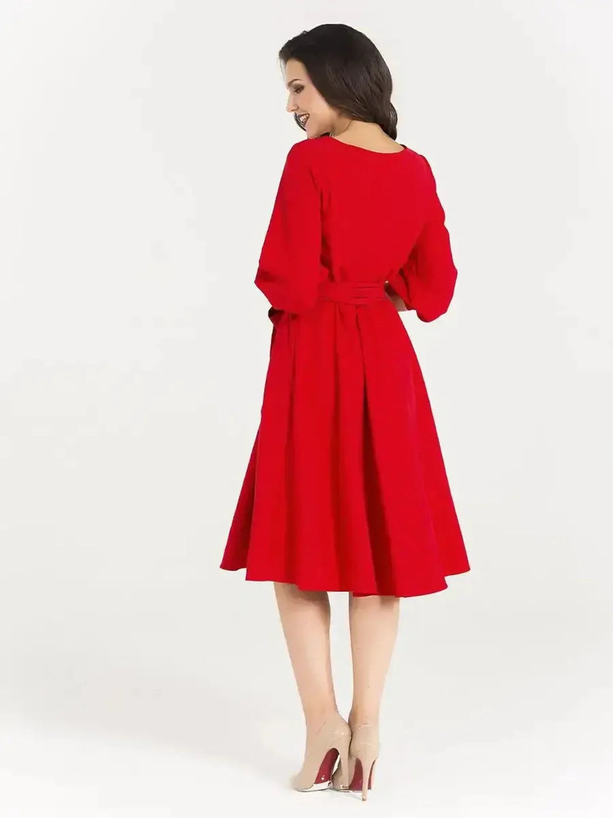 Back view of the Scarlet Poise Midi Dress in striking red, featuring balloon sleeves and a wide tie waist for a flattering silhouette.