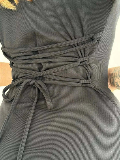 Close-up of the Slate Curve Mini Dress showing the modern lace-up detailing and soft ribbed stretch fabric.