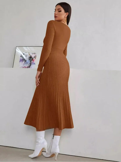 Model showcasing the Sculpted Elegance Midi Dress in warm brown, featuring ribbed texture and a flattering fit.