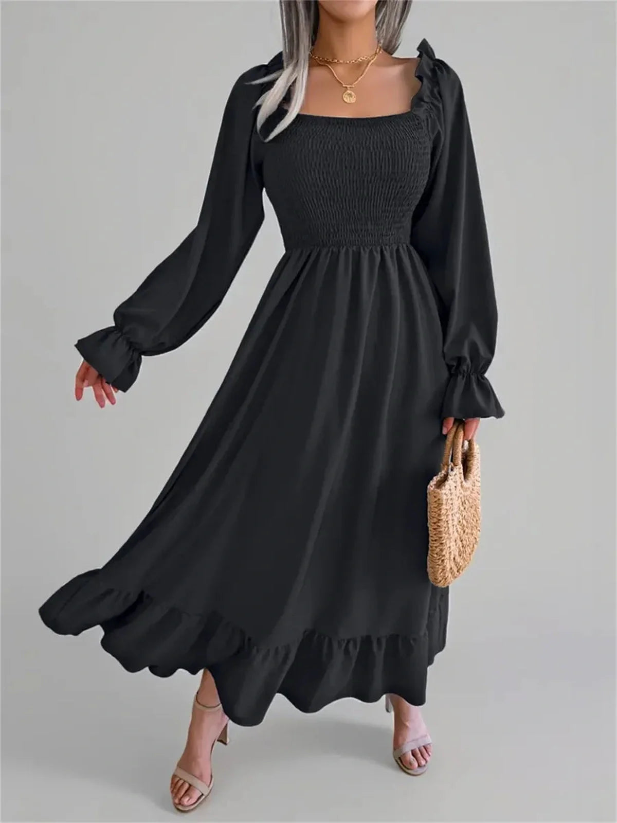 Elegant black Ruffle Grace midi dress with smocked bodice and long sleeves, perfect for ladies' formal and casual occasions.