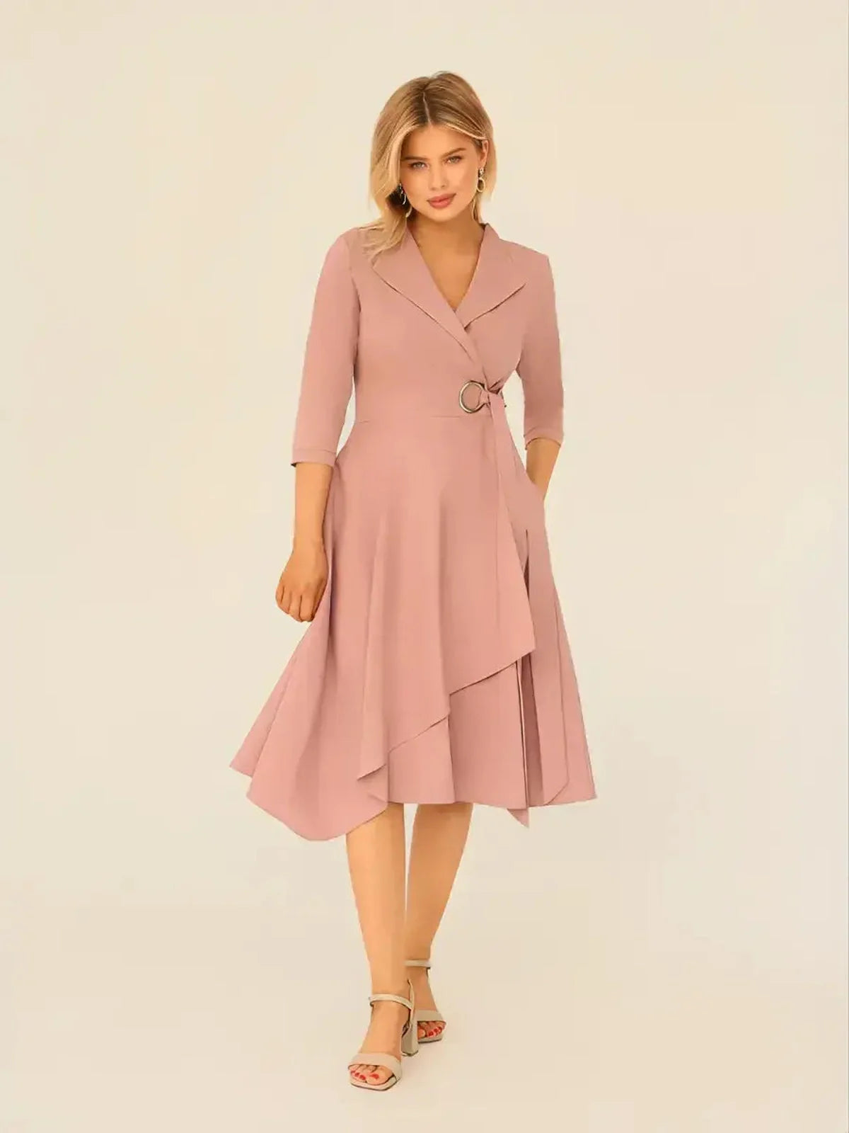 Blush Charm Midi Dress featuring a wrap-front design, asymmetric hem, and ring buckle waist, ideal for weddings and formal events.