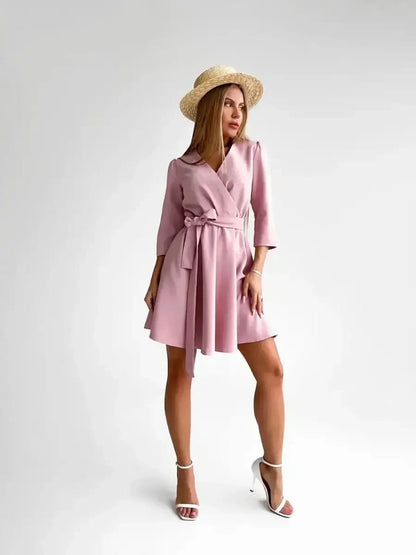 Sophisticated pink mini dress with a tie belt, perfect for weddings, proms, and summer occasions.