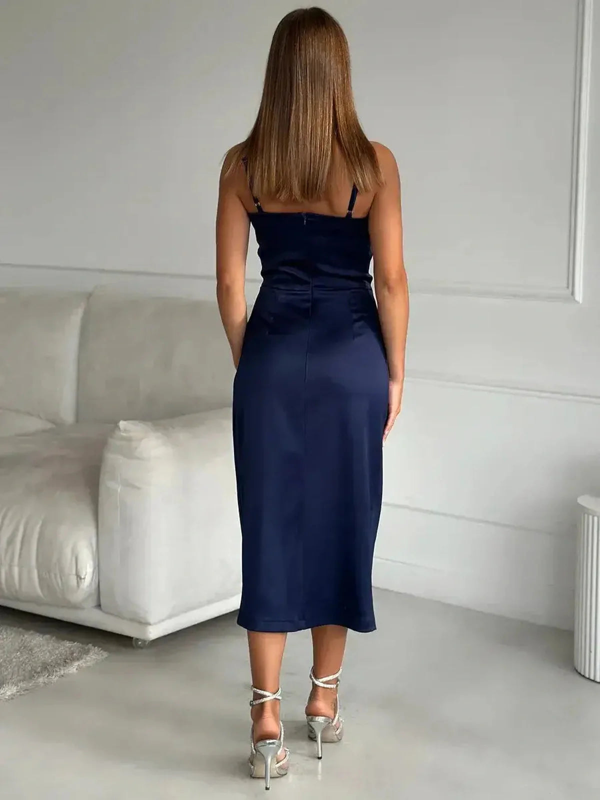 Back view of the Midnight Charm Midi Dress in deep navy satin, showcasing its elegant drape and adjustable straps.