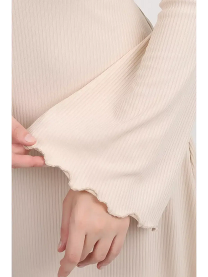 Close-up of the flared bell sleeve of the Ivory Flow Midi Dress showcasing its soft ribbed texture.