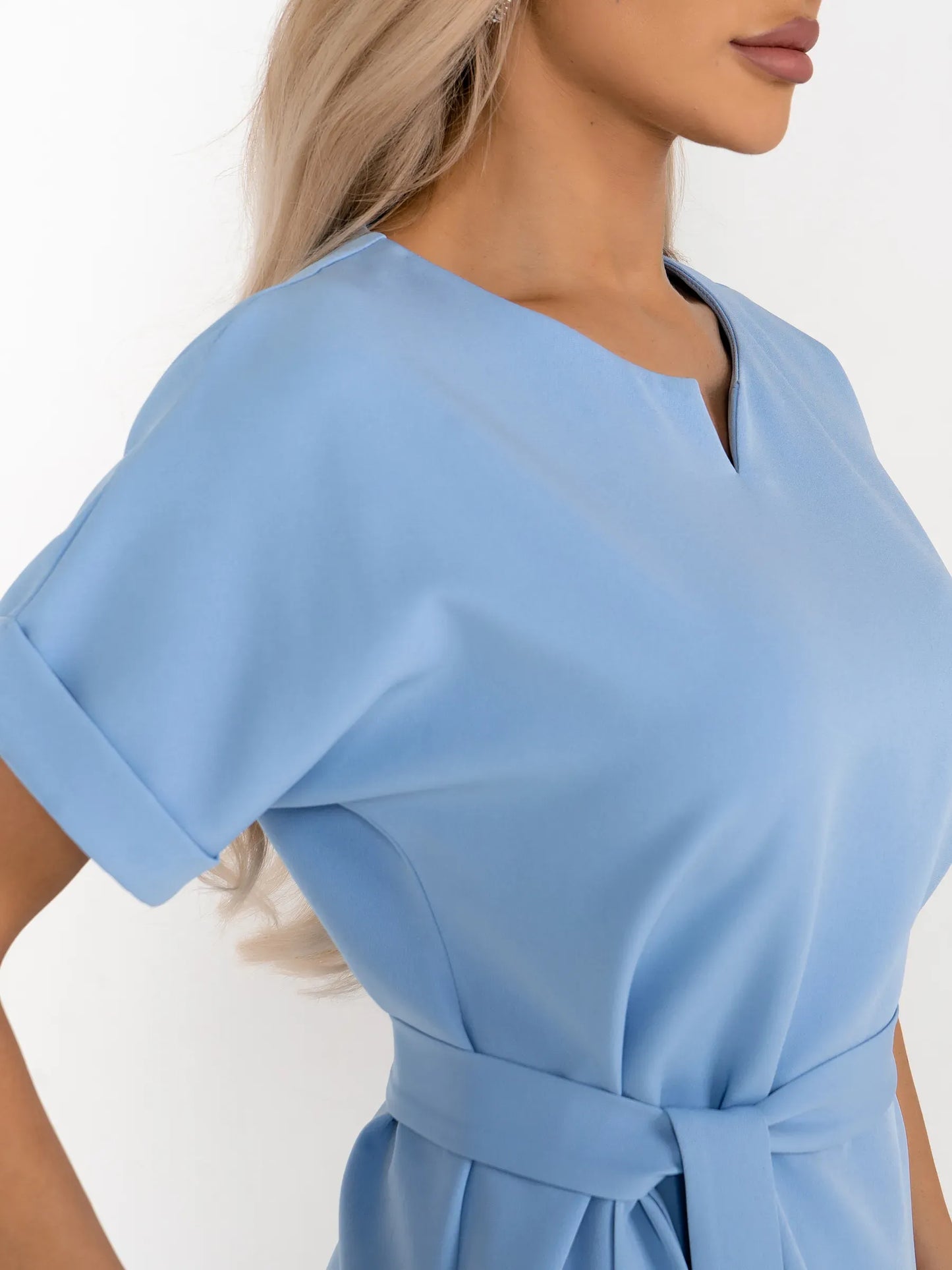 Light blue mini dress with a relaxed sheath silhouette and optional self-tie belt for a flattering fit.