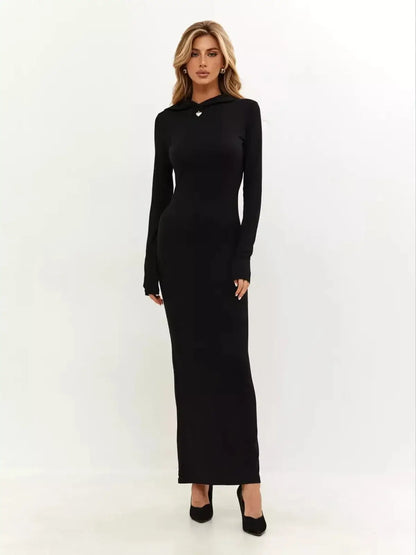 Noir Maxi Dress: Elegant black long-sleeve dress with fitted silhouette and signature hood detail.