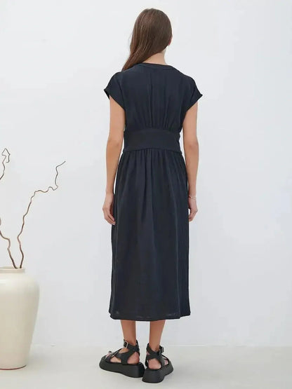 Back view of the Sable Grace Midi Dress showcasing its sculpted waist and fluid design, perfect for summer occasions.