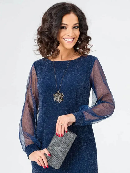 Celeste Midi Dress with sheer sleeves in navy blue, perfect for weddings and evening events, paired with a stylish clutch.