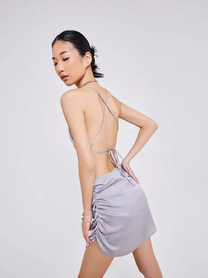 Backless silver-gray mini dress with crisscross tie straps and sultry ruching for summer soirées.