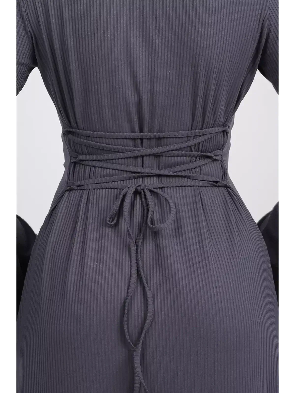 Back view of the Twilight Curve Midi Dress showing tie waist detail and flared sleeves in charcoal grey.