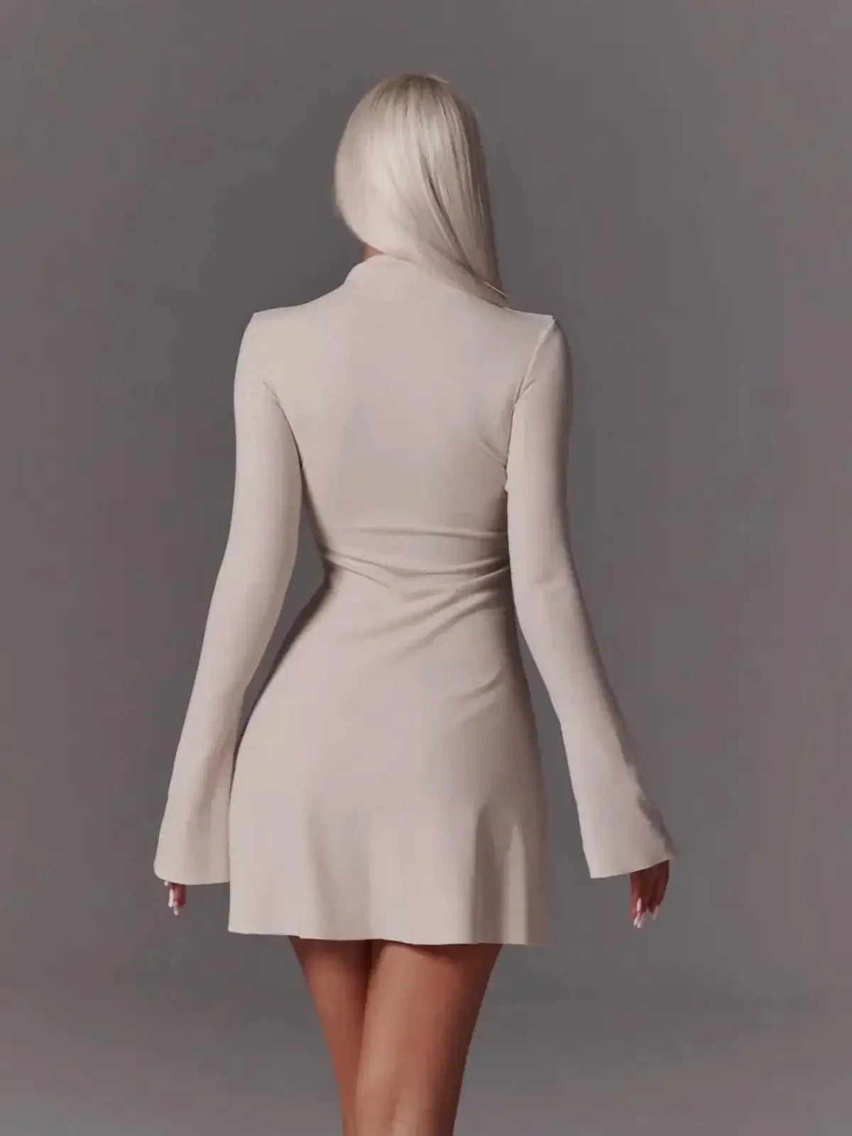 Back view of an ivory flare mini dress with bell sleeves, showcasing sleek style perfect for weddings or parties.