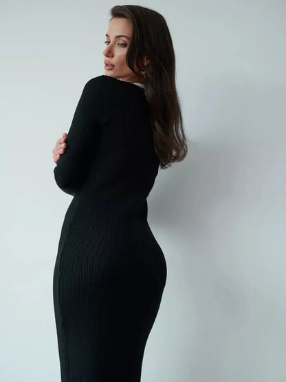 Sculpting black midi dress with long sleeves and a sleek silhouette, ideal for wedding guest or formal occasions.