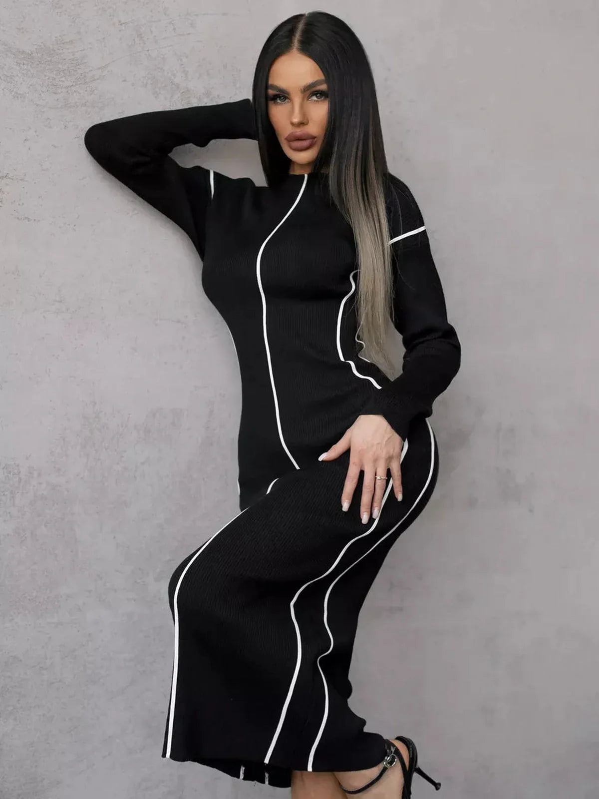 Sculpted Line Midi Dress featuring graphic contrast stripes for an elegant, body-sculpting fit, perfect for weddings or formal occasions.