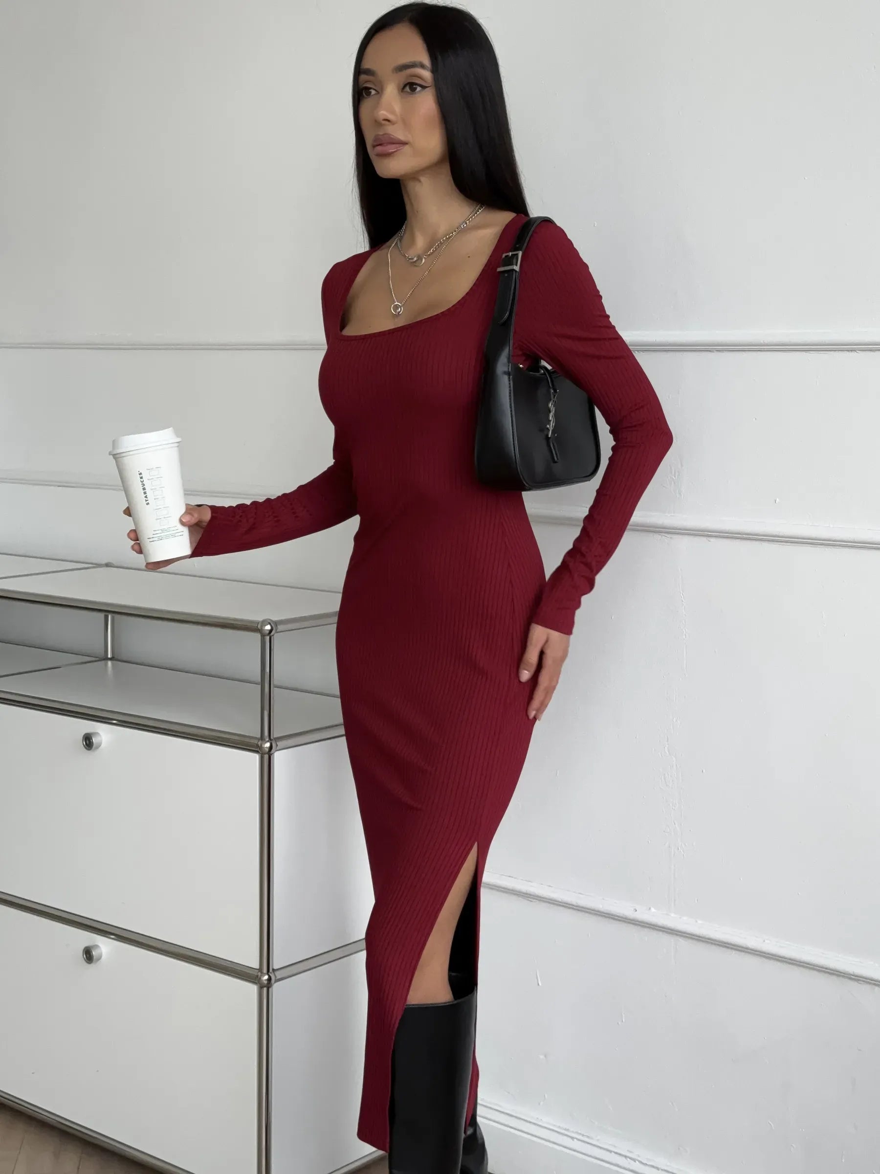 Model in a burgundy Ribbed Grace Midi Dress with side slit, perfect for weddings and special occasions.