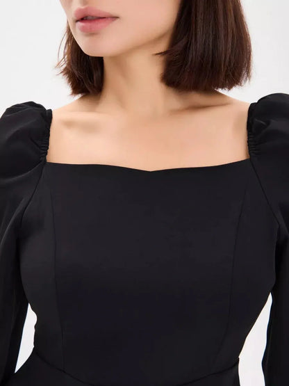 Midnight Frame Mini Dress featuring a square neckline and structured puffed sleeves in elegant black.