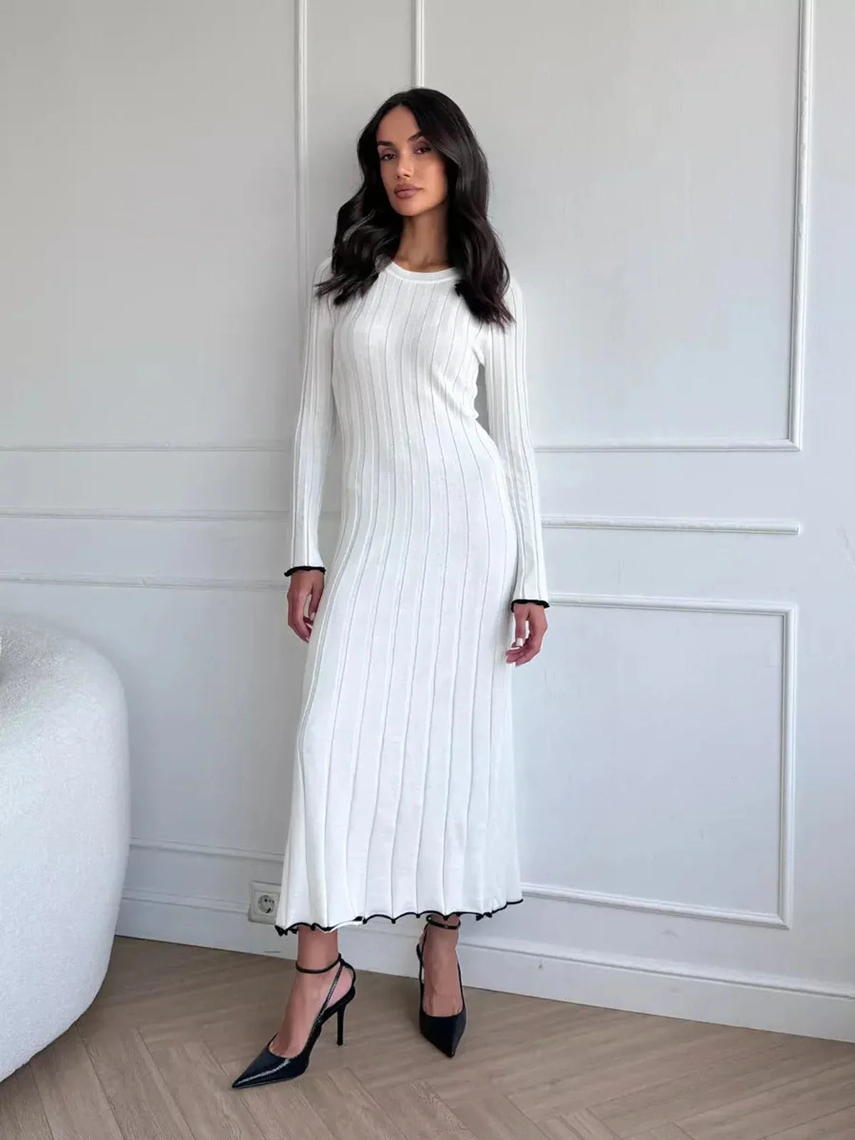 Ivory Grace Maxi Dress with ribbed texture and long sleeves, perfect for weddings and formal events.