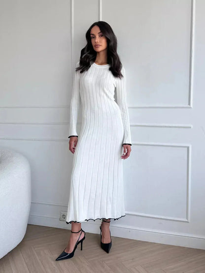 Ivory Grace Maxi Dress with ribbed texture and long sleeves, perfect for weddings and formal events.