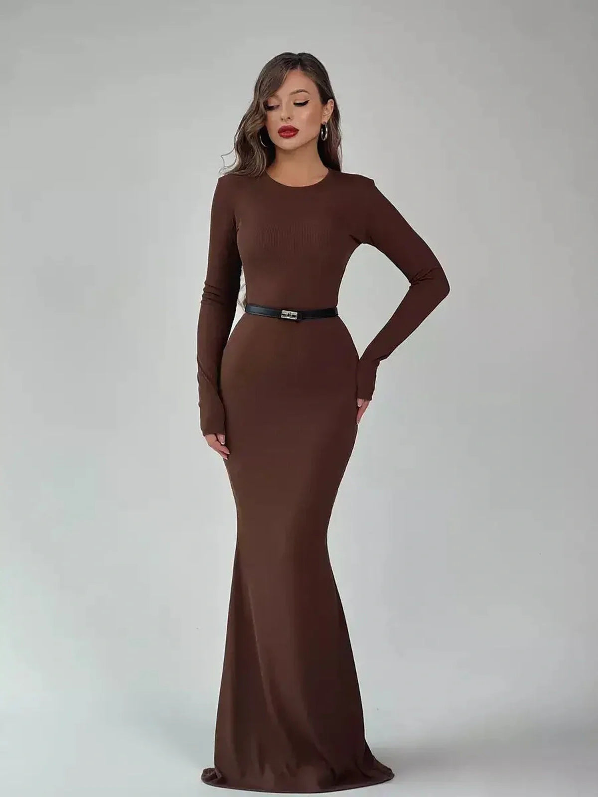 Sculpted Aura Maxi Dress in rich brown, featuring a long silhouette and elegant crew neckline, ideal for weddings and formal events.