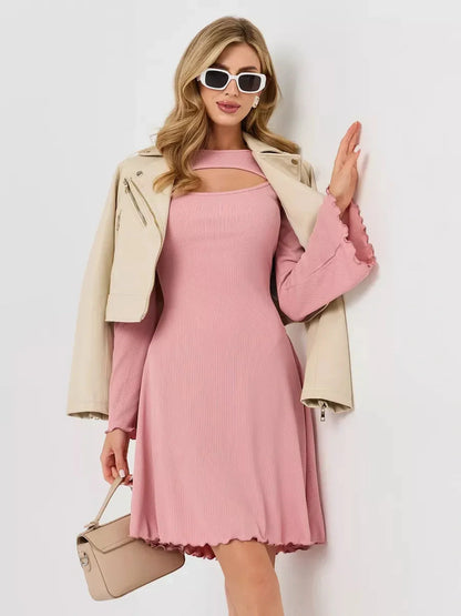 Model wearing a pink Blush Whisper dress with flared sleeves and a stylish jacket, perfect for summer occasions.