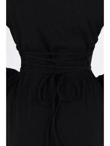 Close-up of the back detail of the Noir Flare Midi Dress showcasing a stylish tied waist in ribbed black fabric.