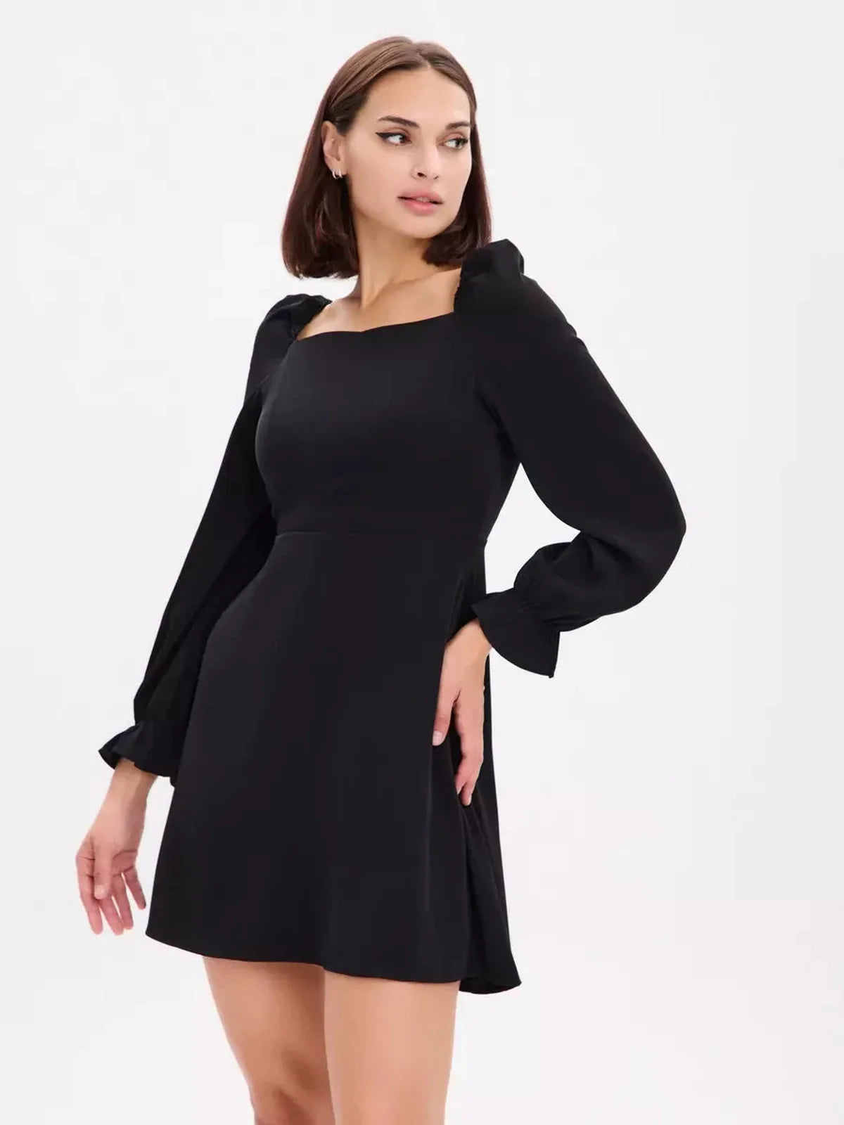 Elegant black mini dress with structured puffed sleeves and a flattering square neckline, perfect for any occasion.