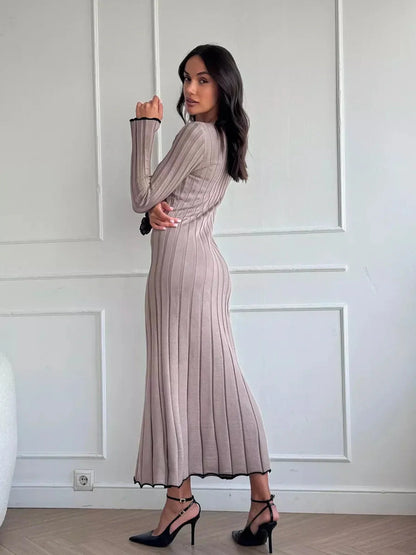 Elegant Contour Maxi Dress in ribbed knit, showcasing a fitted silhouette with contrast ruffle hem, perfect for any occasion.