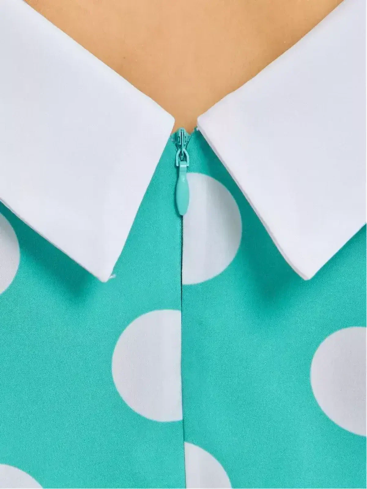 Close-up of Polka Grace Midi Dress collar and zipper detail showcasing vintage design.
