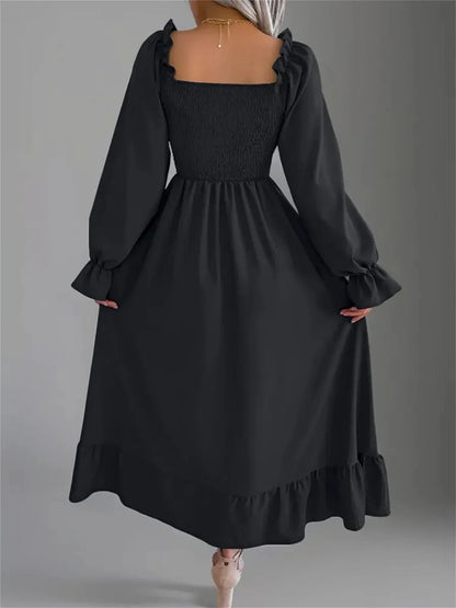 Black Ruffle Grace Midi Dress with smocked bodice and long sleeves, perfect for formal events and casual gatherings.